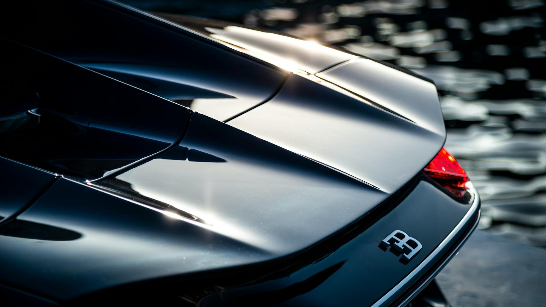 Close-up of a luxury Bugatti supercar reflecting elegance in Marbella, Spain.