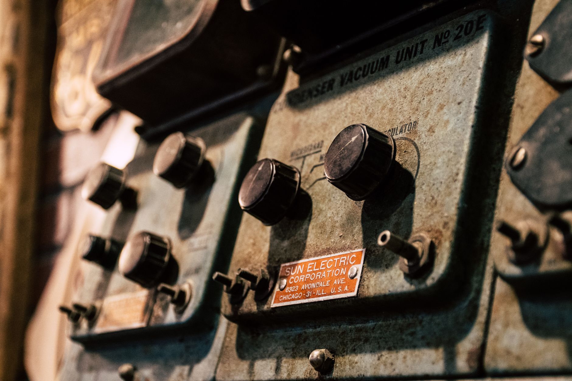 Detailed look at an aged industrial machine with rust and dials, showcasing vintage technology.
