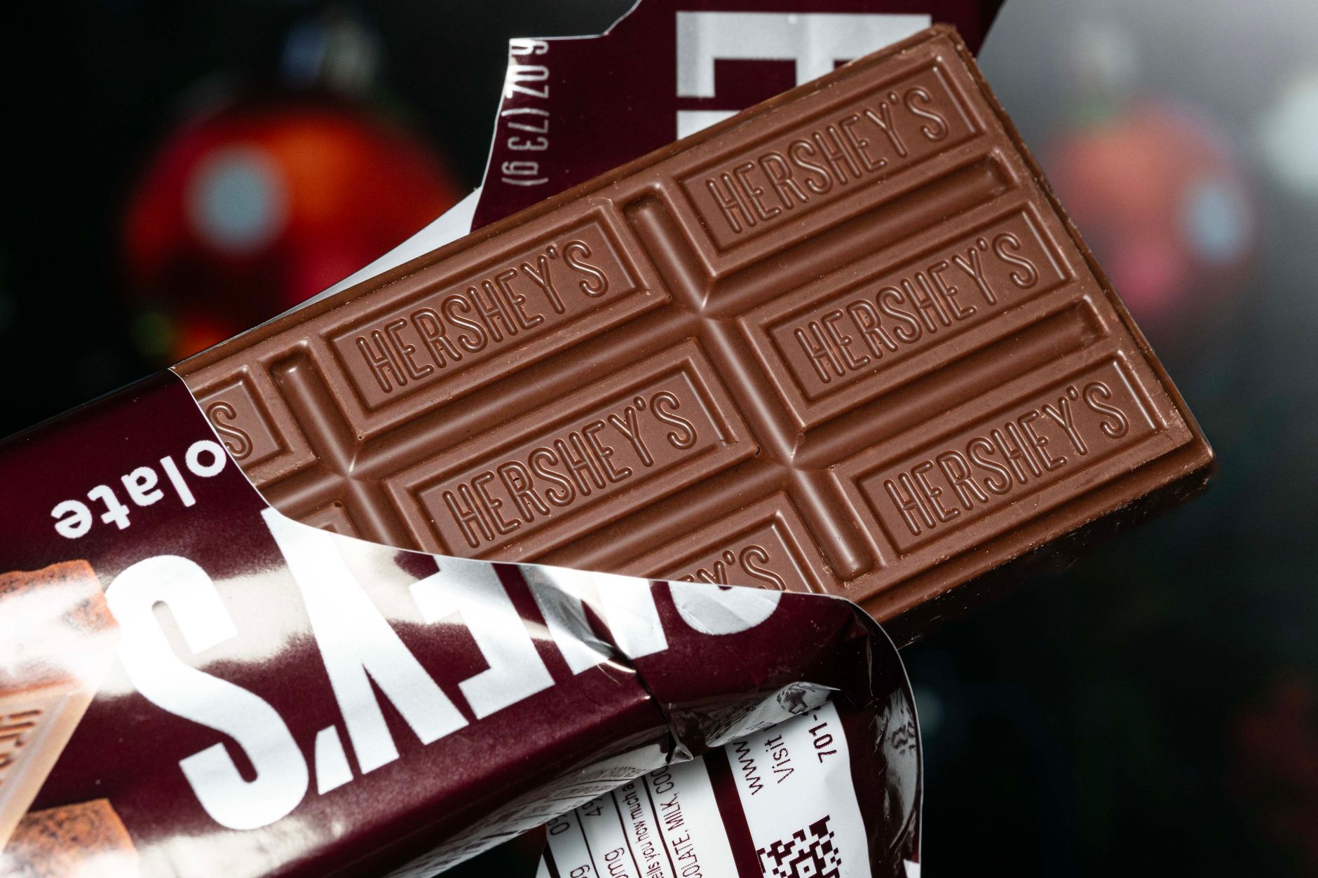 Unwrapped Hershey's chocolate bar revealing its iconic design.